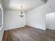 Dining room with wood floors, white walls and a chandelier at 2253 Atrium Cir, Orlando, FL 32808