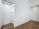 Neutral entryway with wood floors, white walls and recessed lighting at 2253 Atrium Cir, Orlando, FL 32808