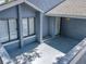 Inviting front porch with gray flooring and a white door at 2253 Atrium Cir, Orlando, FL 32808