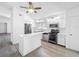 Open kitchen boasts stainless steel appliances, and eat-in counter at 2253 Atrium Cir, Orlando, FL 32808