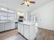 White kitchen with stainless appliances and natural light at 2253 Atrium Cir, Orlando, FL 32808