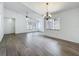 Bright living room featuring wood floors, ceiling fan, and modern lighting at 2253 Atrium Cir, Orlando, FL 32808