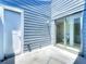Enclosed patio with sliding glass doors leading to the bathroom and a painted blue wooden fence at 2253 Atrium Cir, Orlando, FL 32808