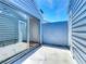Enclosed patio featuring sliding glass doors leading to the bedroom and painted blue walls at 2253 Atrium Cir, Orlando, FL 32808