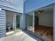 View of the enclosed patio with access to the bathroom and a bedroom with hardwood floors at 2253 Atrium Cir, Orlando, FL 32808
