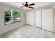 Bedroom featuring two closets, a ceiling fan and tiled floors at 233 Chadworth Dr, Kissimmee, FL 34758