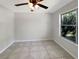 Bright bedroom with tile flooring, a large window, and neutral walls at 233 Chadworth Dr, Kissimmee, FL 34758