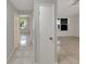 Hallway showcasing tiled floors that connect to multiple rooms at 233 Chadworth Dr, Kissimmee, FL 34758