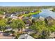 Aerial view of residential neighborhood with waterfront properties and lush landscaping at 237 Rialto Rd, Kissimmee, FL 34759