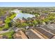 Aerial view of the neighborhood showcasing lakefront homes and mature trees at 237 Rialto Rd, Kissimmee, FL 34759