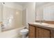 Bathroom with a combined tub and shower, vanity with wood cabinets, and toilet at 237 Rialto Rd, Kissimmee, FL 34759