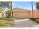 Charming single-Gathering home showcasing a large two-car garage and a well-manicured front yard with lush landscaping at 237 Rialto Rd, Kissimmee, FL 34759