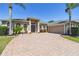 Lovely home with brick driveway and well maintained landscaping at 2480 Northumbria Dr, Sanford, FL 32771