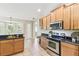 Well-lit kitchen with tile flooring and stainless steel appliances at 2480 Northumbria Dr, Sanford, FL 32771