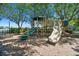 Charming community playground with slides, stairs, and a protective mulch surface, providing a fun space for children at 2480 Northumbria Dr, Sanford, FL 32771