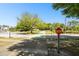 Street view of the community with green crosswalk and tree lined street on a sunny day at 2480 Northumbria Dr, Sanford, FL 32771