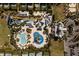 Overhead shot of a community waterpark, pools, slides, buildings, and lots of parking at 321 Pendant Ct, Kissimmee, FL 34747