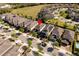 Aerial view of a suburban neighborhood featuring well-maintained homes, lawns, and tree-lined streets at 321 Pendant Ct, Kissimmee, FL 34747