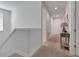 Neutral upstairs hallway featuring carpet floors and white walls at 321 Pendant Ct, Kissimmee, FL 34747