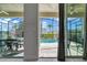 Screened in lanai featuring a view of the pool with chairs and an outdoor dining area at 321 Pendant Ct, Kissimmee, FL 34747