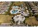 Birds-eye view of the waterpark, surrounded by houses, pools, palm trees, and beautifully kept lawns at 321 Pendant Ct, Kissimmee, FL 34747