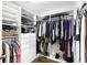 Walk-in closet with built-in shelving and drawers to store clothing and personal belongings at 3780 Woodhurst Ct, Oviedo, FL 32766