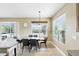 Bright dining area featuring contemporary table with seating for six, and clear views of private pool and lanai at 3780 Woodhurst Ct, Oviedo, FL 32766