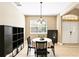 Dining room with a round table, chandelier, ceramic tile floor, and neutral paint at 3780 Woodhurst Ct, Oviedo, FL 32766