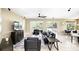 Open concept living room with a ceiling fan, neutral paint, and sliding door access to the pool at 3780 Woodhurst Ct, Oviedo, FL 32766