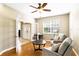 Cozy living room with hardwood floors, neutral paint, lots of natural light, and French doors at 3780 Woodhurst Ct, Oviedo, FL 32766