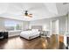 Spacious main bedroom features hardwood floors, a tray ceiling, and ample natural light, creating a serene retreat at 3780 Woodhurst Ct, Oviedo, FL 32766