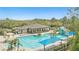 Overhead shot showcasing a community pool, slide, lounge chairs, and beautiful landscaping on a bright day at 3780 Woodhurst Ct, Oviedo, FL 32766