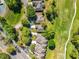 An aerial view of homes adjacent to a lush golf course showcasing a beautiful community layout at 3960 Villas Green Cir, Longwood, FL 32779