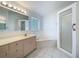 Bright bathroom featuring a soaking tub, glass block window and a walk-in shower at 3960 Villas Green Cir, Longwood, FL 32779
