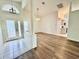 Inviting foyer featuring tile flooring, white trim, and an open layout leading to the kitchen and living areas at 3960 Villas Green Cir, Longwood, FL 32779