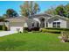 Charming single-story home with well-maintained landscaping and inviting curb appeal at 3960 Villas Green Cir, Longwood, FL 32779