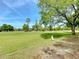 Expansive golf course views with lush green grass and mature trees under a bright blue sky at 3960 Villas Green Cir, Longwood, FL 32779