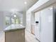 Bright kitchen with a center island and modern, stainless steel appliances at 3960 Villas Green Cir, Longwood, FL 32779