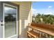 Cozy balcony with wood furnishings providing a relaxing outdoor space with views of tropical palm trees at 4622 Eureka Ln, Sanford, FL 32773