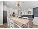 Open concept dining room with modern light fixture, wood floors, and seamless flow to the kitchen at 4622 Eureka Ln, Sanford, FL 32773