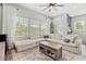 Bright living room with a large sectional sofa, an area rug, and many windows that provide natural light at 4622 Eureka Ln, Sanford, FL 32773