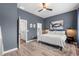 Beautiful main bedroom featuring a ceiling fan, ensuite bath, and accent wall at 4622 Eureka Ln, Sanford, FL 32773