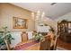 Dining room features a chandelier, fireplace, and ample space for entertaining guests at 512 Weston Pl, Debary, FL 32713