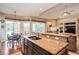 Stylish kitchen with granite countertops, stainless steel sink, and seamless connection to the inviting living area at 512 Weston Pl, Debary, FL 32713