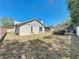 A cozy backyard with a white fence and grass ready to be personalized at 7646 Covedale Dr, Orlando, FL 32818