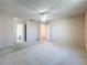 Bright bedroom featuring a ceiling fan, neutral walls, and carpet flooring at 7646 Covedale Dr, Orlando, FL 32818