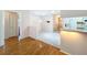 View of the bright dining area adjacent to the kitchen with hardwood floors and a chandelier at 7646 Covedale Dr, Orlando, FL 32818