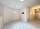 Dining area with hanging chandelier and white tile floors at 7646 Covedale Dr, Orlando, FL 32818