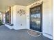 A close up of the front porch with a security door and accent decor at 7646 Covedale Dr, Orlando, FL 32818