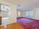 Bright living room with large window and neutral walls at 7646 Covedale Dr, Orlando, FL 32818